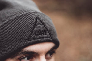 Close up of Grey triangle logo with OH! embroidered in the centre