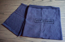 Grey Snood with black OUT HOUSE lettering embroidered on it