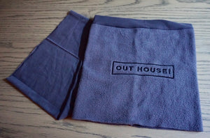 Grey Snood with black OUT HOUSE lettering embroidered on it