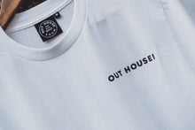 White t-shirt with black OUT HOUSE! print on the left chest Black neck tag with white OUT HOUSE SNOW EST.2017 stitching