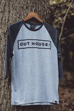 Grey Raglan with contrast Dark heather grey sleeves. OUT HOUSE! logo vinyl printed across chest and triangle logo hem label stitched bottom left hem